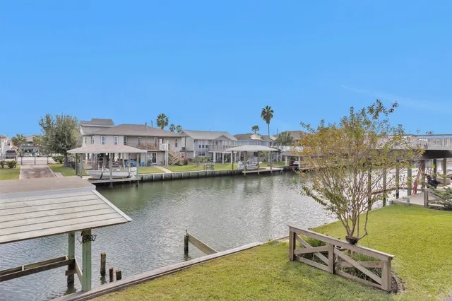 a view of a lake with boats and trees in the background