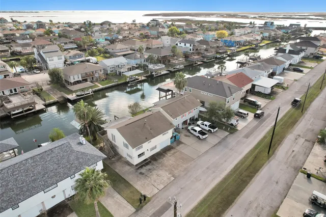 an aerial view of a house with a lake view