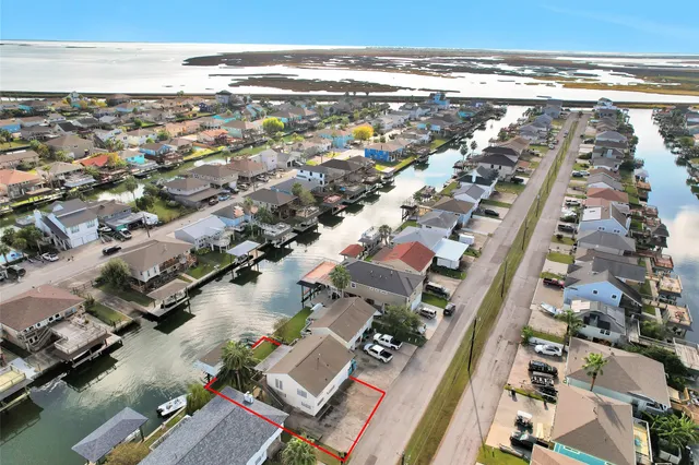 an aerial view of residential building and lake