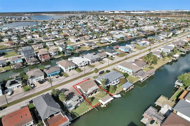 an aerial view of a city with ocean view
