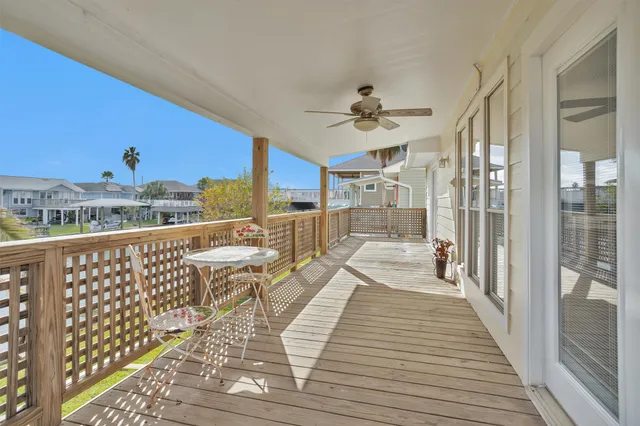 a view of a balcony with wooden floor