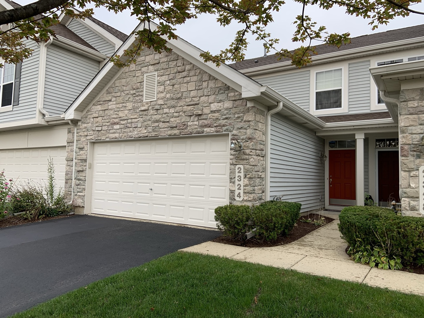 2324 Georgetown Court, Unit 152 Aurora, IL 60503 - Photo 1 of 1 front view of house with a yard