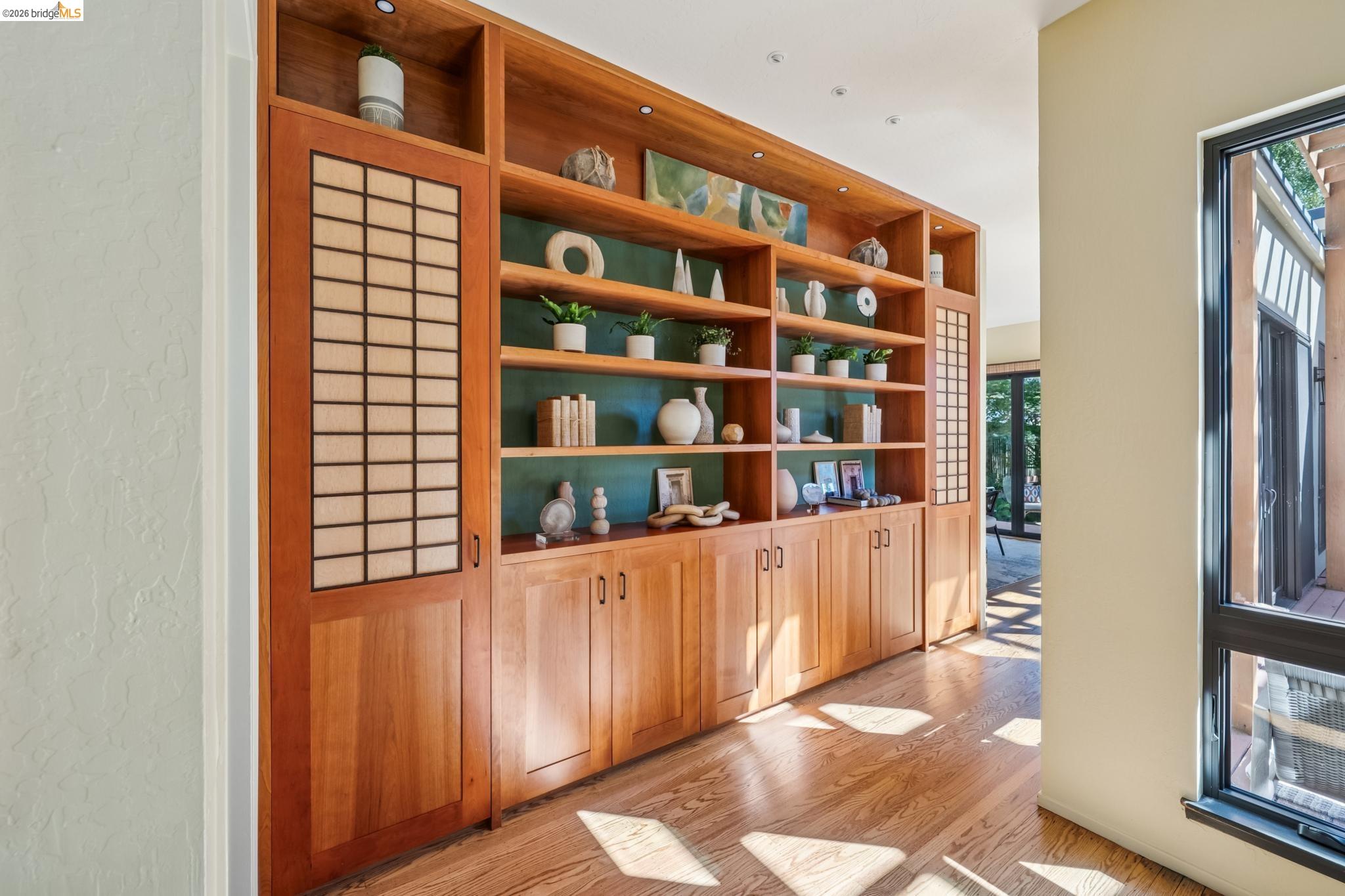 576 Vistamont Avenue Berkeley, CA 94708 - Photo 6 of 33 Integrated wood-finish shelving unit with built-in cabinetry and recessed lighting