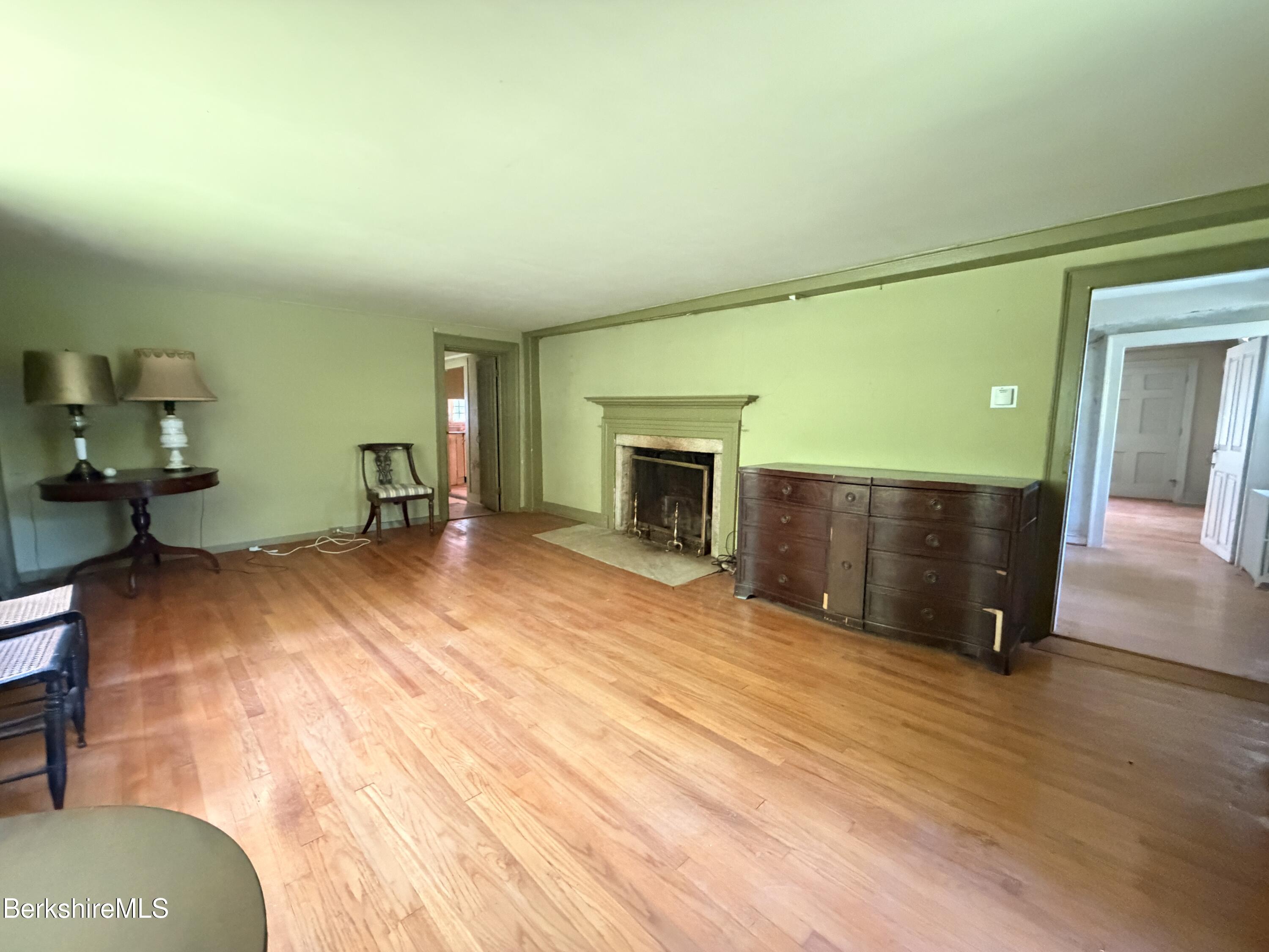 254 Main Street Sheffield, MA 01257 - Photo 9 of 13 a view of a livingroom with wooden floor and furniture