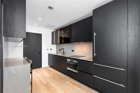 a kitchen with stainless steel appliances a refrigerator and a sink