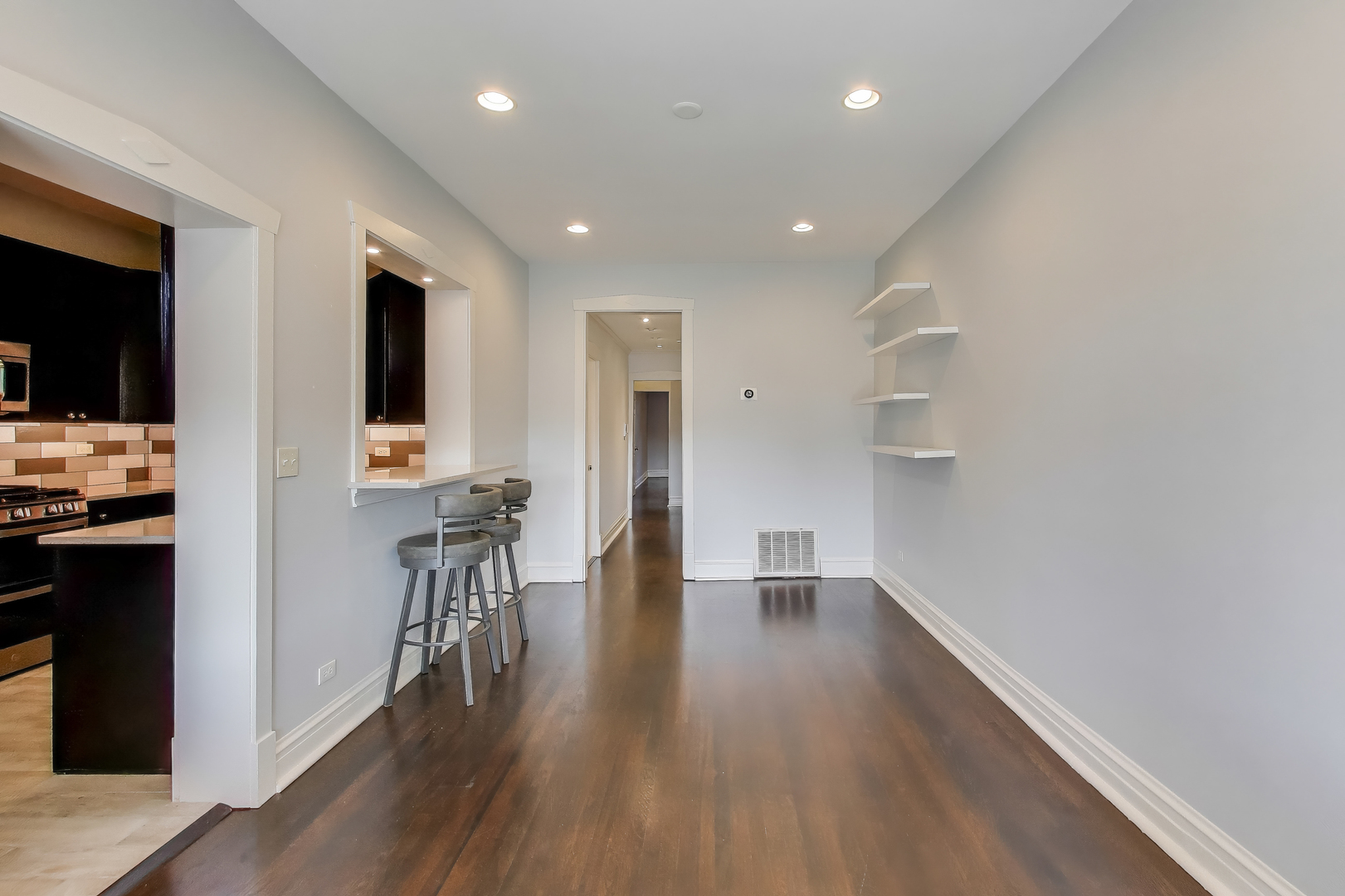1447 West Warner Avenue, Unit 3W Chicago, IL 60613 - Photo 13 of 27 a view of a kitchen with cabinets and wooden floor