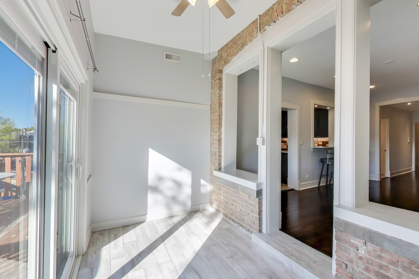 1447 West Warner Avenue, Unit 3W Chicago, IL 60613 - Photo 15 of 27 a view of a hallway view with wooden floor and living room