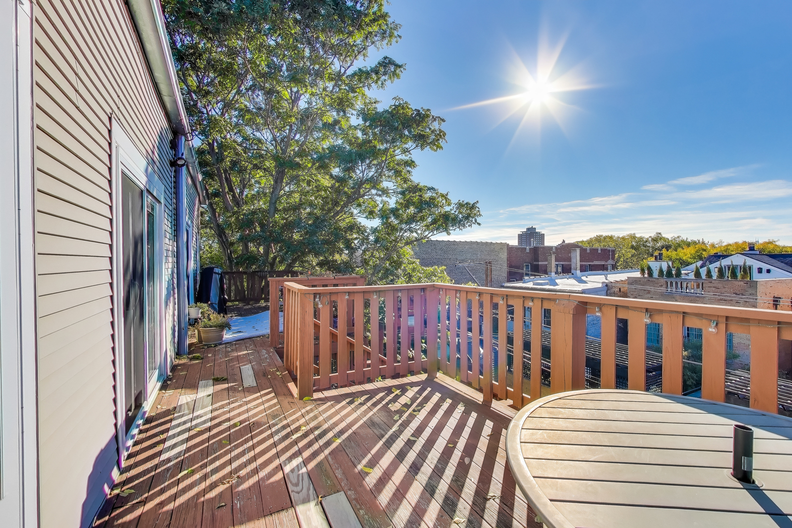 1447 West Warner Avenue, Unit 3W Chicago, IL 60613 - Photo 25 of 27 a view of a balcony with wooden floor