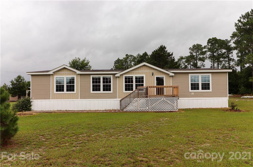4024 Steen Road Mount Croghan, SC 29727 - Photo 1 of 37 a front view of house with yard and swimming pool