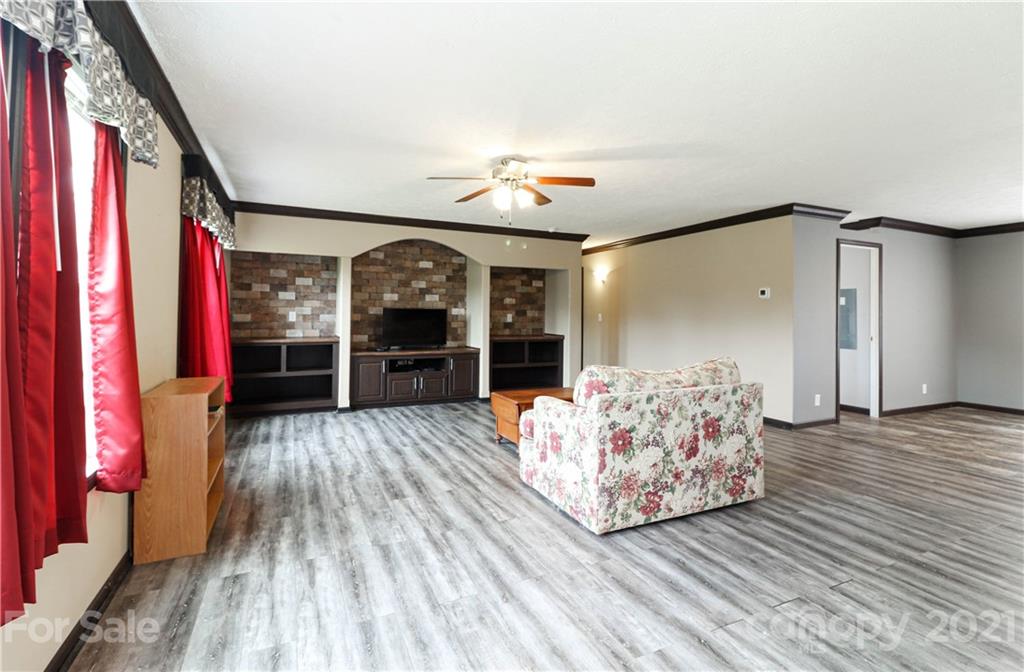 4024 Steen Road Mount Croghan, SC 29727 - Photo 12 of 37 a living room with furniture and a fireplace