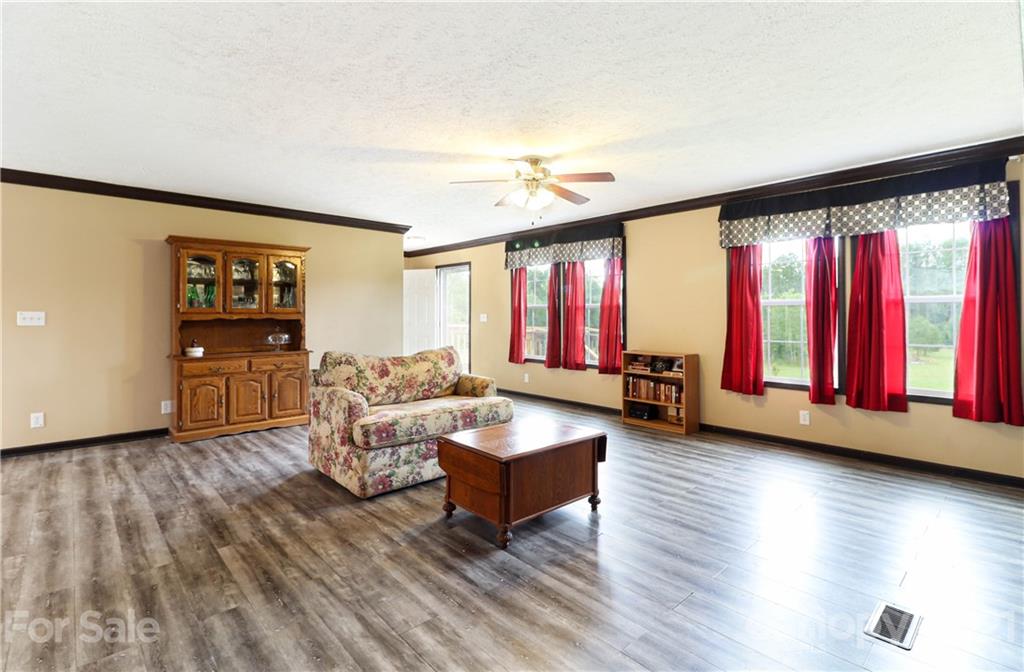 4024 Steen Road Mount Croghan, SC 29727 - Photo 13 of 37 a living room with furniture and wooden floor