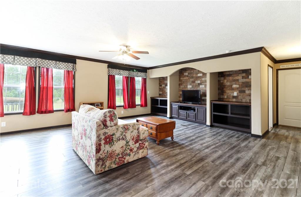4024 Steen Road Mount Croghan, SC 29727 - Photo 14 of 37 a living room with furniture fireplace and flat screen tv
