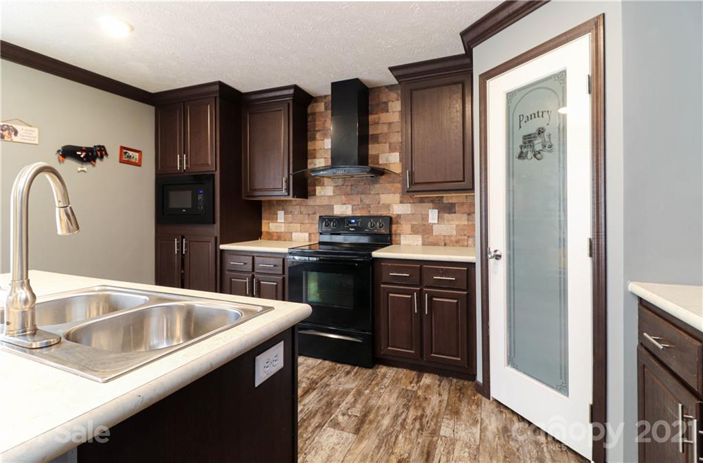 4024 Steen Road Mount Croghan, SC 29727 - Photo 19 of 37 a kitchen with stainless steel appliances granite countertop a sink stove and refrigerator
