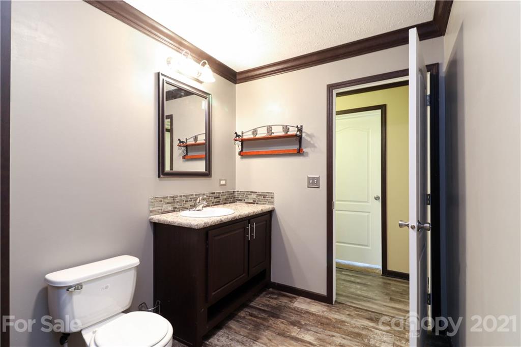 4024 Steen Road Mount Croghan, SC 29727 - Photo 23 of 37 a bathroom with a toilet sink and mirror