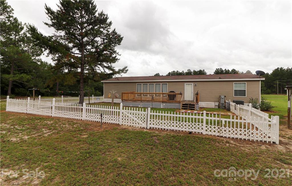 4024 Steen Road Mount Croghan, SC 29727 - Photo 33 of 37 a view of a house with a fence