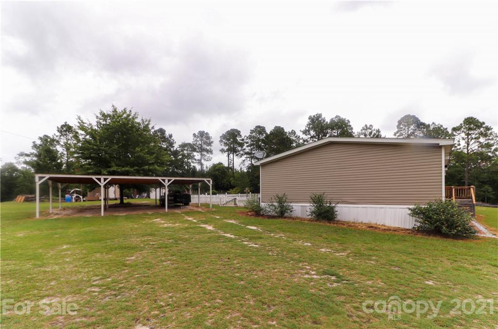4024 Steen Road Mount Croghan, SC 29727 - Photo 34 of 37 a view of a house with pool and chairs