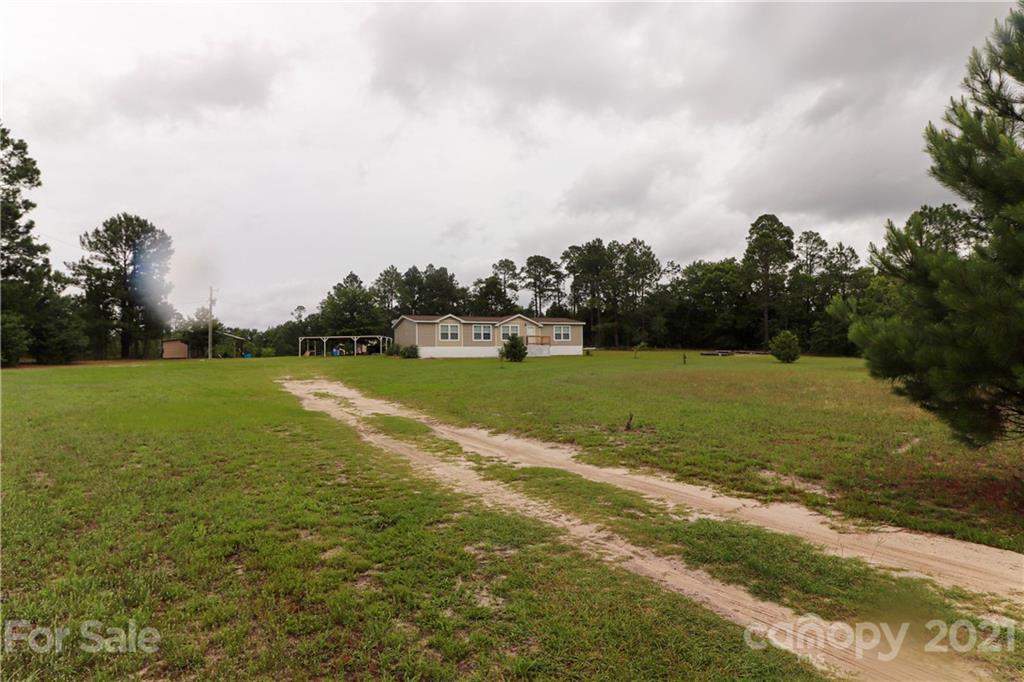 4024 Steen Road Mount Croghan, SC 29727 - Photo 36 of 37 a view of a lake with a big yard