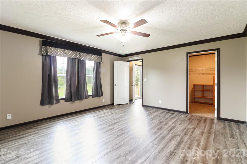 4024 Steen Road Mount Croghan, SC 29727 - Photo 7 of 37 a view of an empty room with window and wooden floor