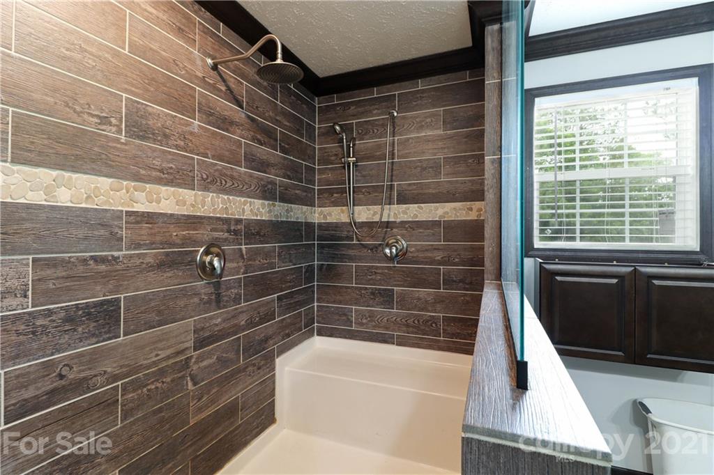 4024 Steen Road Mount Croghan, SC 29727 - Photo 10 of 37 a bathroom with a shower and a bathtub