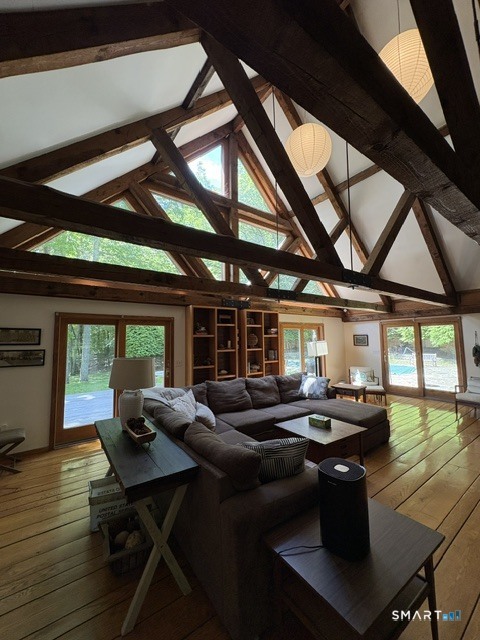 40 Looking Glass Hill Road Litchfield, CT 06750 - Photo 7 of 33 a living room with large couches and dining room with wooden floor