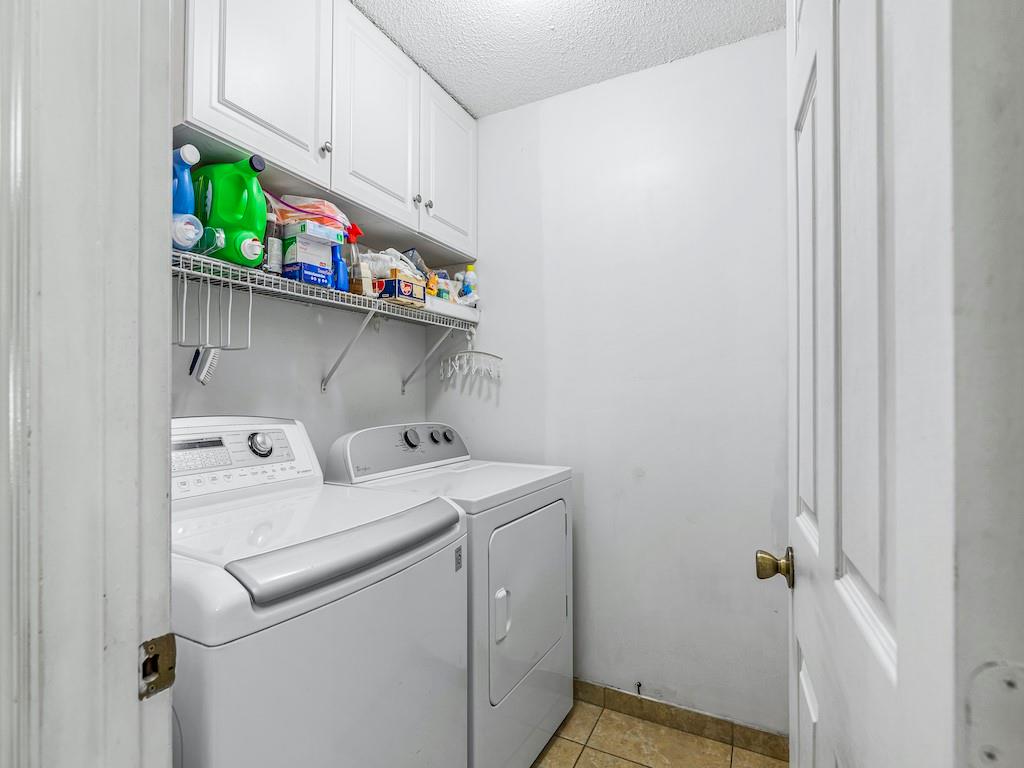 941 Southwest Longfellow Road Port St. Lucie, FL 34953 - Photo 22 of 36 a utility room with dryer and washer