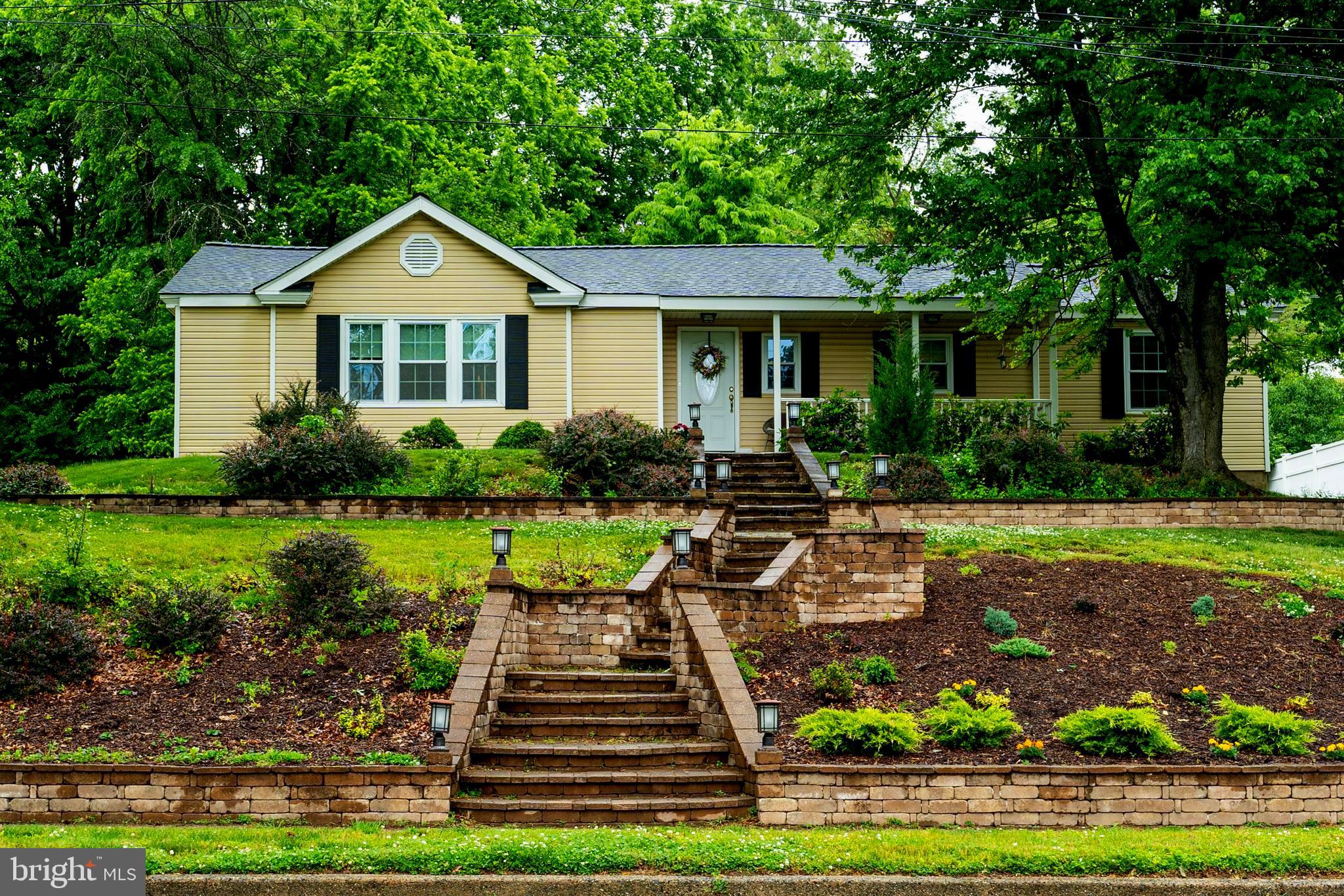 2941 Pheasant Run Road Norristown, PA 19403 - Photo 4 of 23 a front view of a house with garden