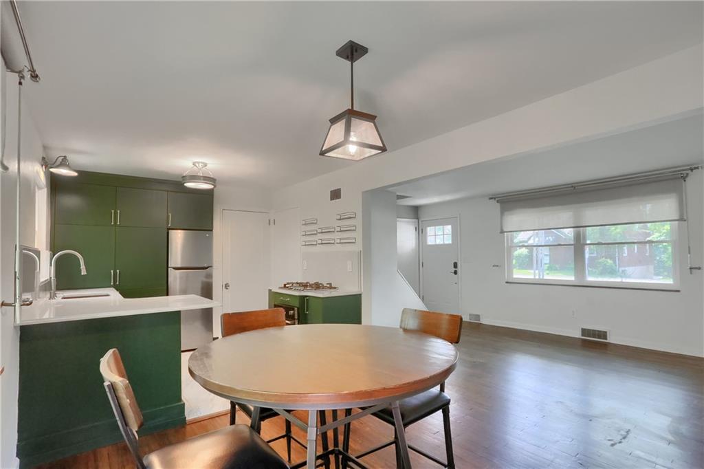 331 Hoffman Road Pittsburgh, PA 15212 - Photo 10 of 40 A stylish light is featured in the eat in dining area.