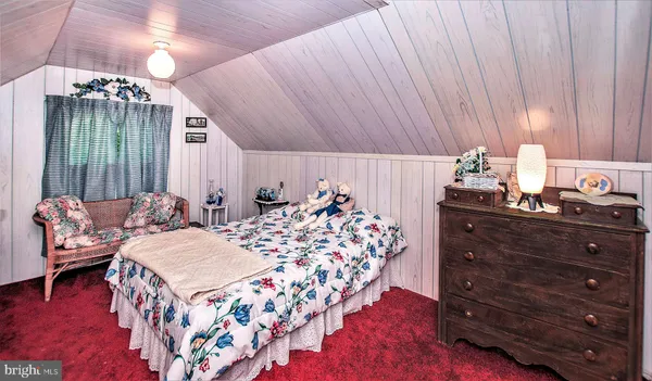 a bed room with a bed and a chandelier