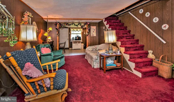a balcony filled with furniture and stairs