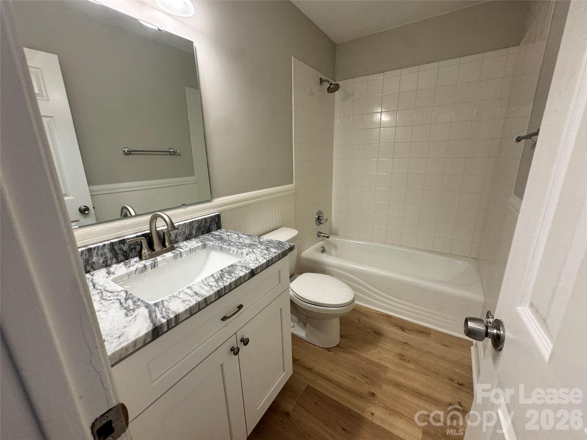 6314 Harrisburg Road Charlotte, NC 28227 - Photo 11 of 16 a bathroom with a granite countertop sink toilet and shower