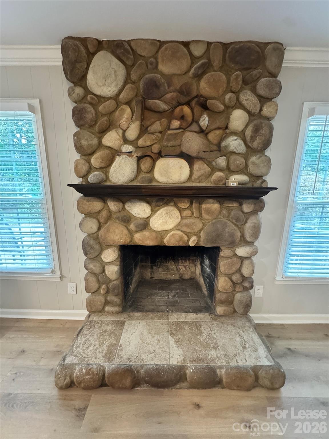 6314 Harrisburg Road Charlotte, NC 28227 - Photo 7 of 16 a room with a fireplace and a window