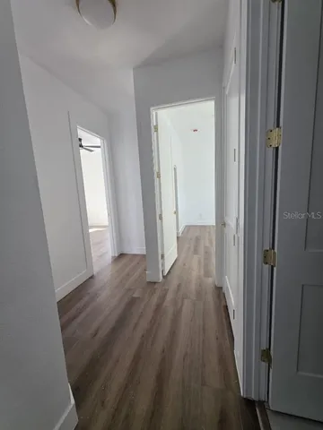 a view of entryway with wooden floor