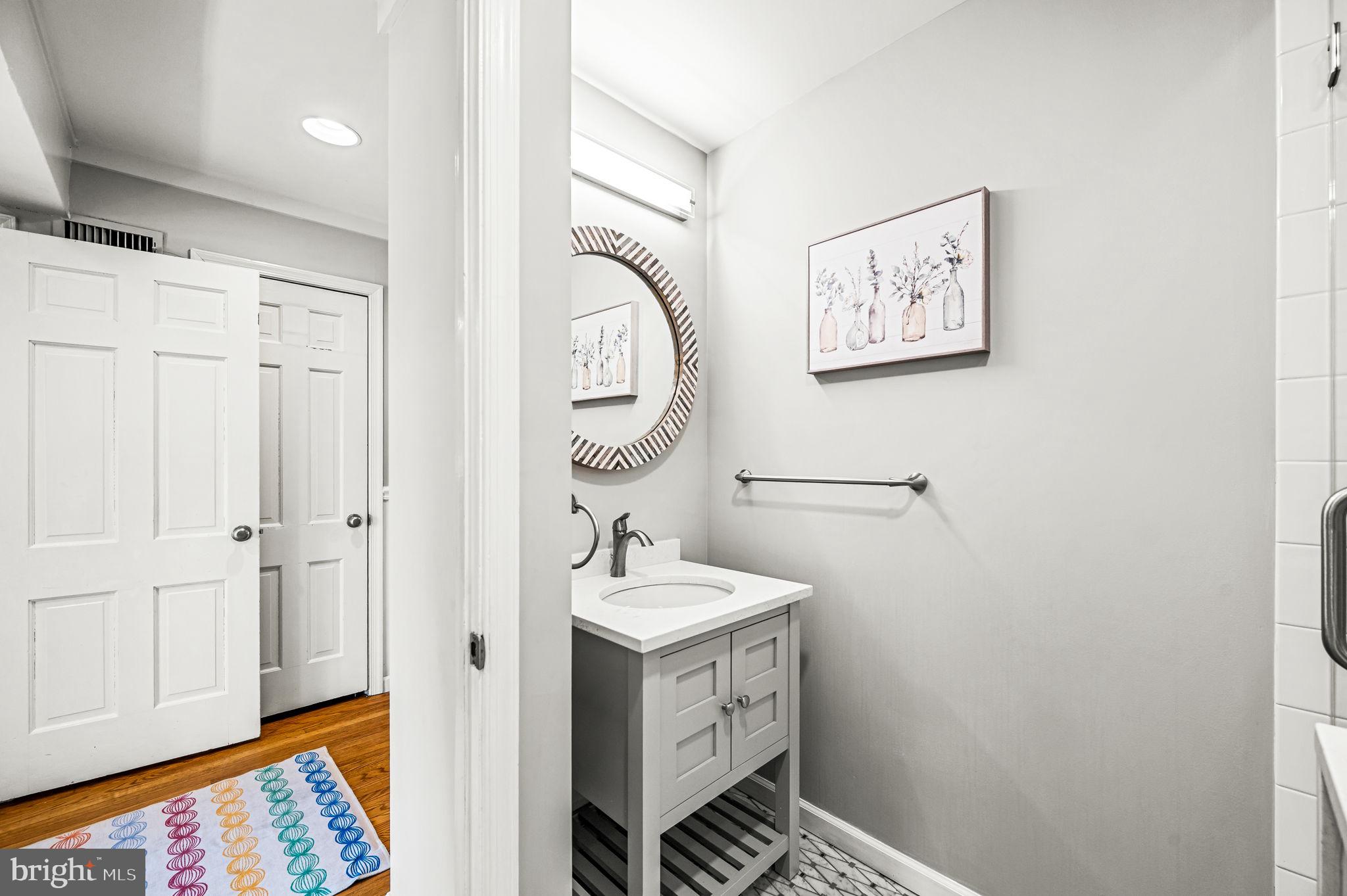 124 South Providence Road Wallingford, PA 19086 - Photo 21 of 53 a bathroom with a sink and a mirror