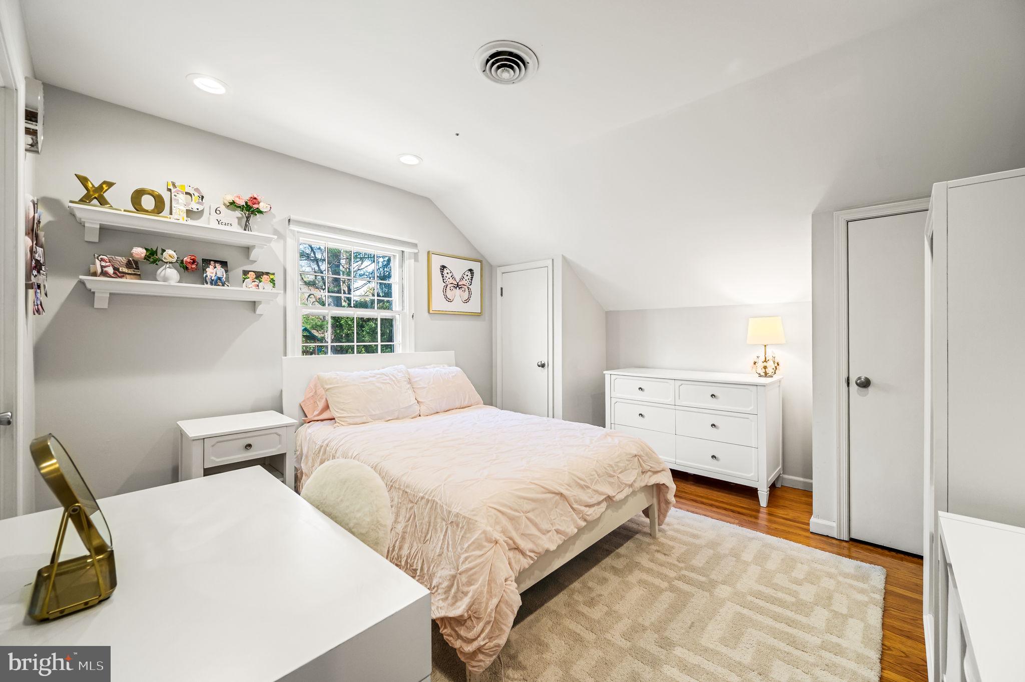 124 South Providence Road Wallingford, PA 19086 - Photo 31 of 53 a bedroom with a bed and wooden floor