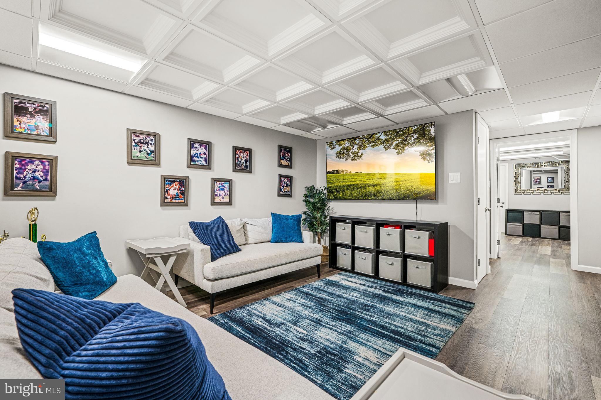 124 South Providence Road Wallingford, PA 19086 - Photo 32 of 53 a living room with furniture and a flat screen tv