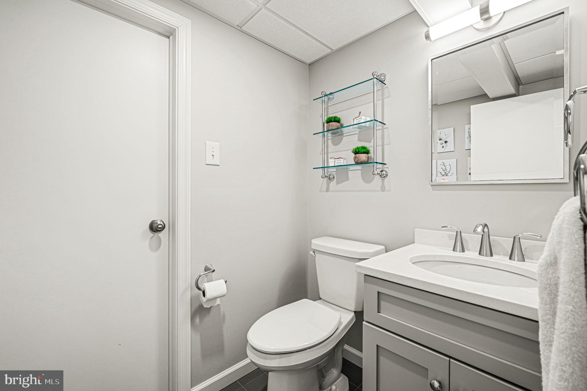 124 South Providence Road Wallingford, PA 19086 - Photo 36 of 53 a white toilet sitting next to a bathroom sink