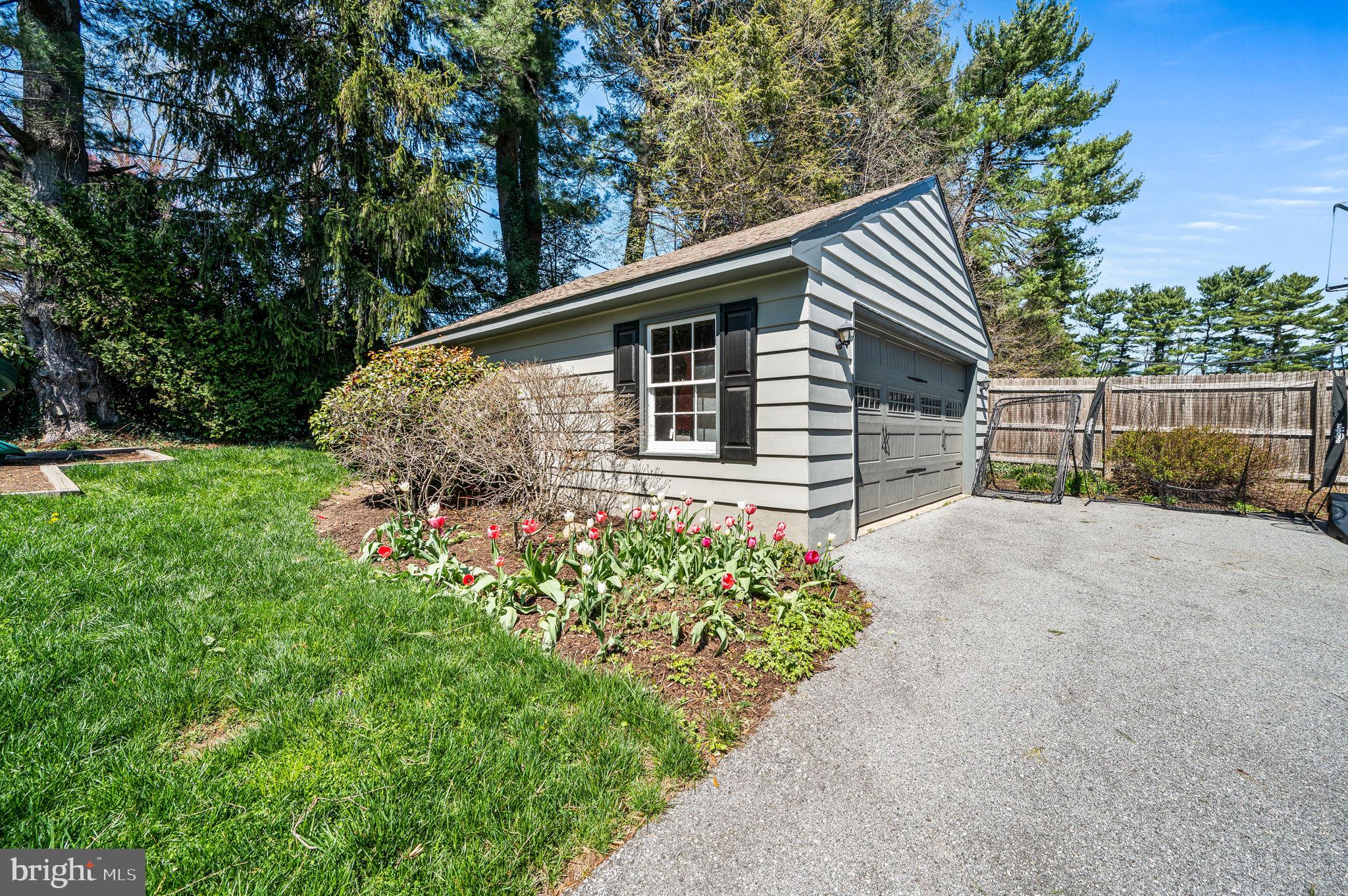 124 South Providence Road Wallingford, PA 19086 - Photo 41 of 53 a backyard of a house with lots of green space