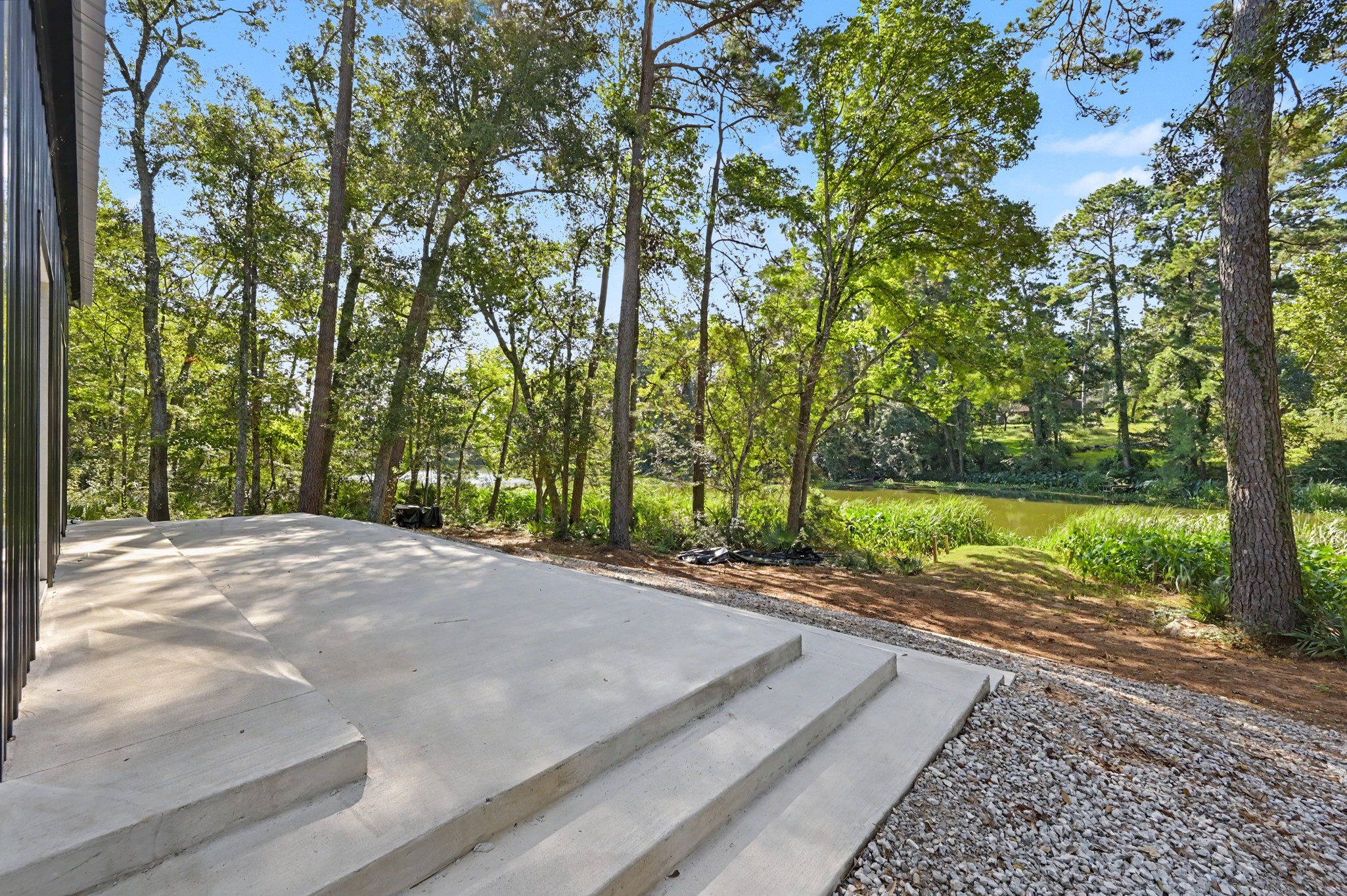 13501 Fultz Road Conroe, TX 77304 - Photo 18 of 30 47' long back patio deck with views of the lake.