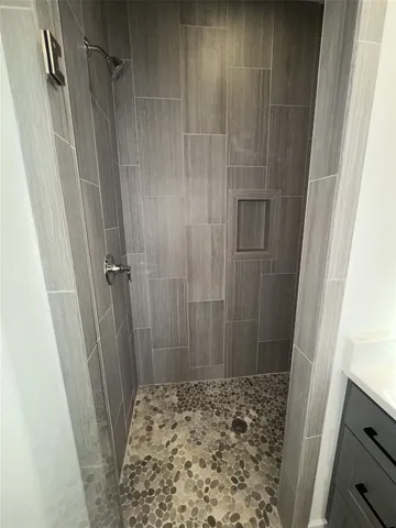 a bathroom with a bathtub and a sink