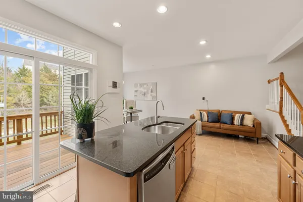 a kitchen with a stove a sink and a microwave