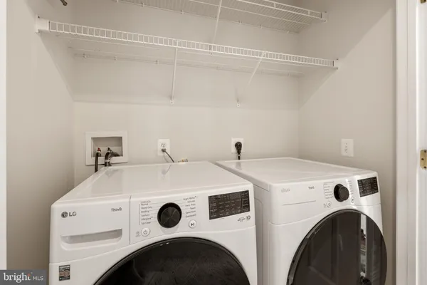 a bathroom with a sink toilet vanity and shower