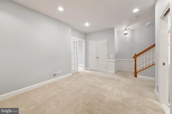 a view of an empty room with a fireplace