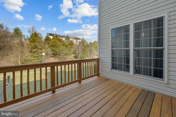 a view of a balcony with wooden floor
