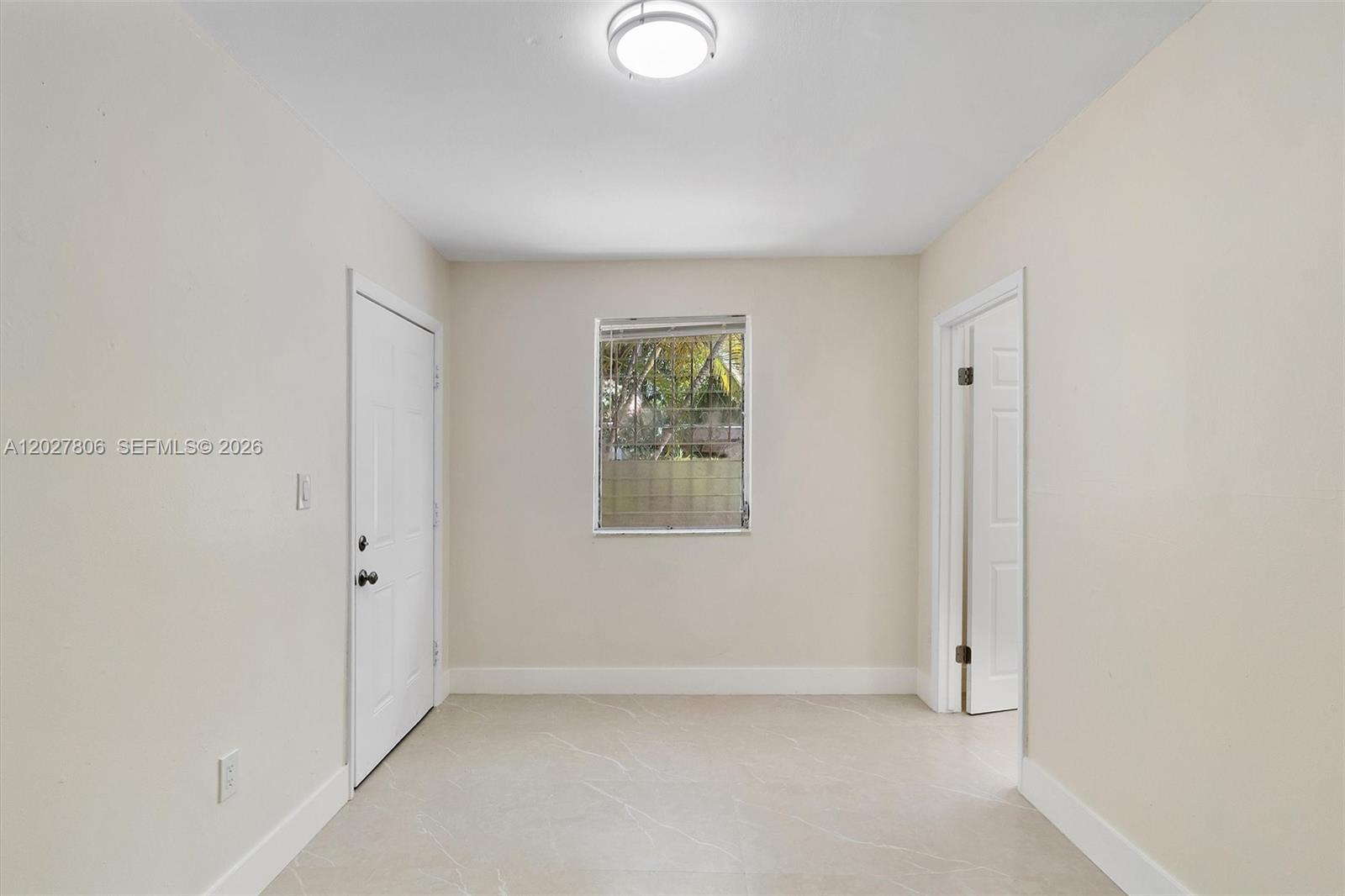 1612 Southwest 23rd Street, Unit 1612 Miami, FL 33145 - Photo 31 of 42 an empty room with windows