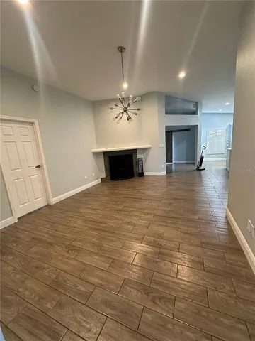 a view of a livingroom with a kitchen