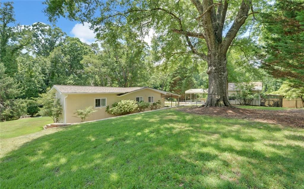 1858 Pinecrest Road Gainesville, GA 30501 - Photo 40 of 55 a front view of a house with garden