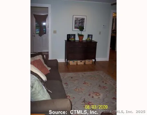 a workspace room with furniture and wooden floor