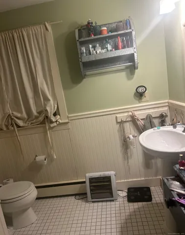a bathroom with a sink and a toilet