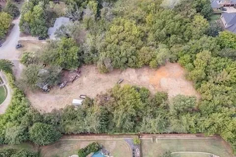 an aerial view of house with yard and outdoor seating