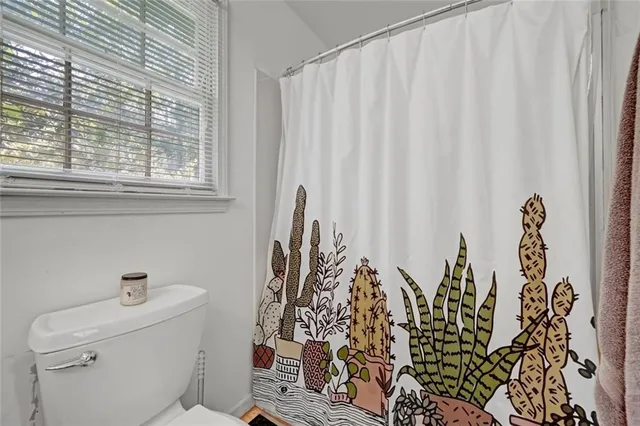 a bathroom with a toilet and sink